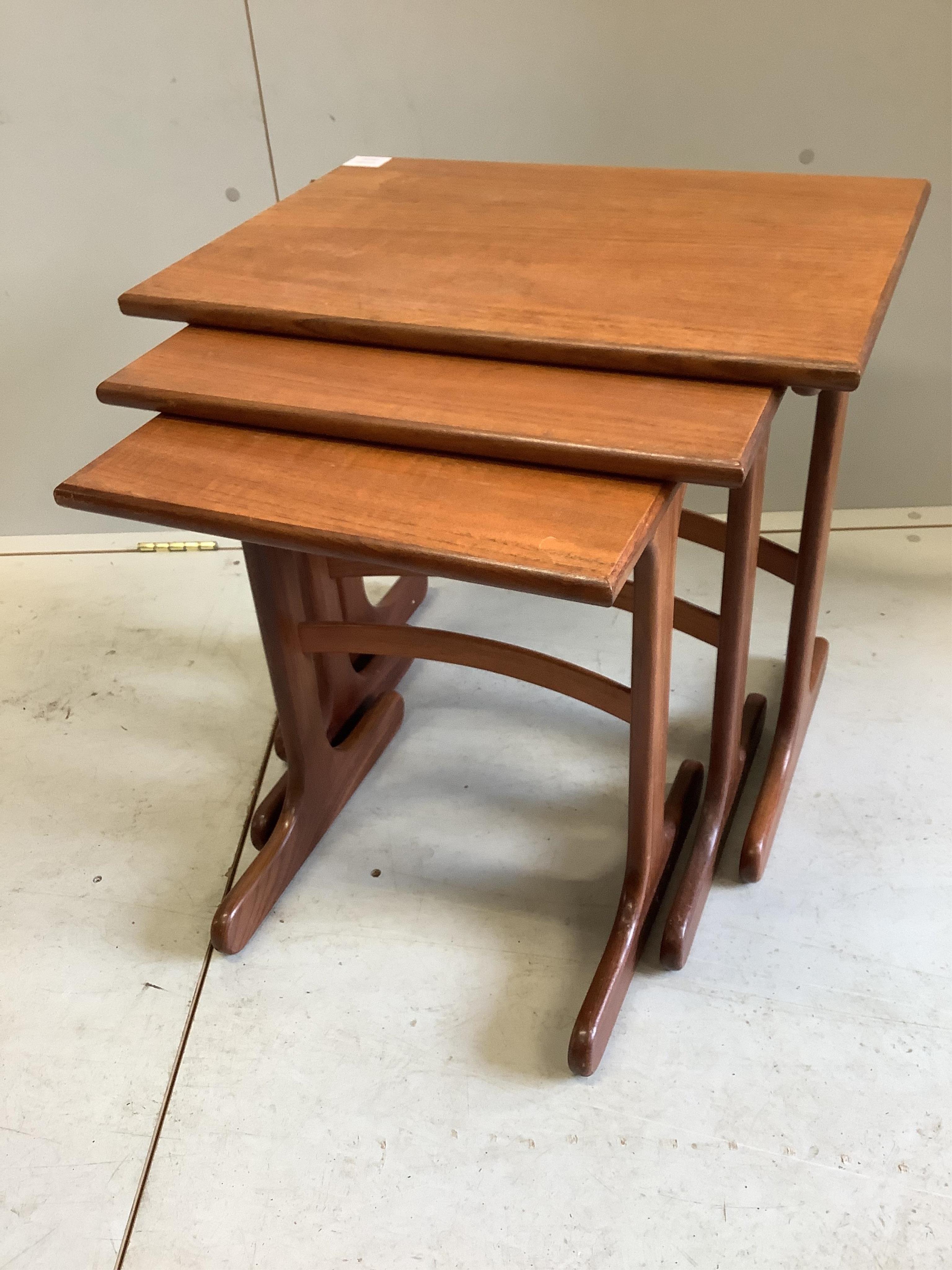 A nest of three G-Plan teak tables, width 56cm, depth 40cm, height 52cm. Condition - fair